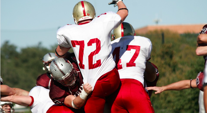 player being held on a field goal attempt in football
